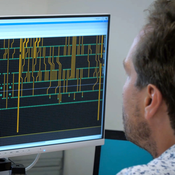 Mr. Jacobi looks at a screen with data streams