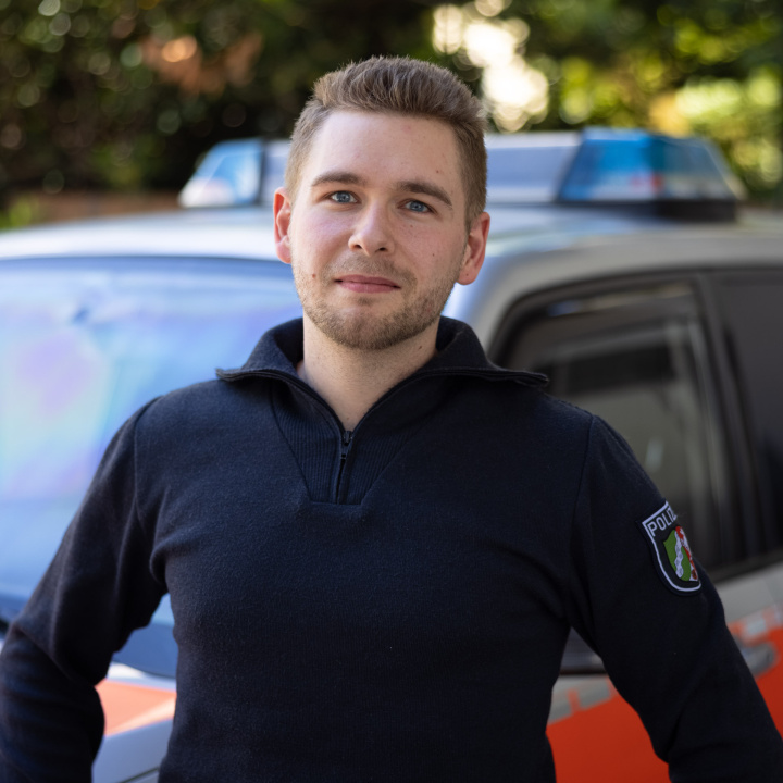 Emergency paramedic in front of emergency vehicle