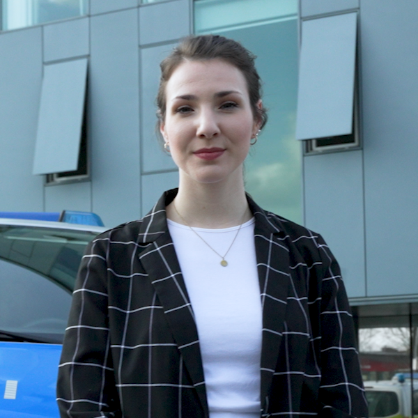 Isabelle Rust, spokeswoman for the Mettmann police, stands in front of a police car