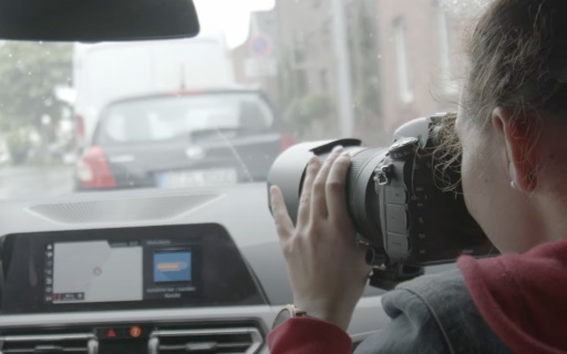 Observation team in car with camera