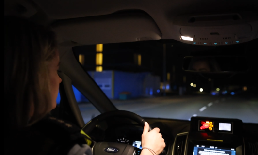 Police officer behind the wheel of a vehicle